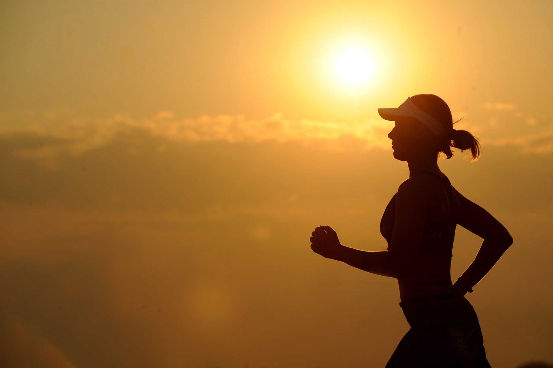 Women running at sun set